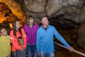 Photo of a family and guide deep inside of Jewel Cave.