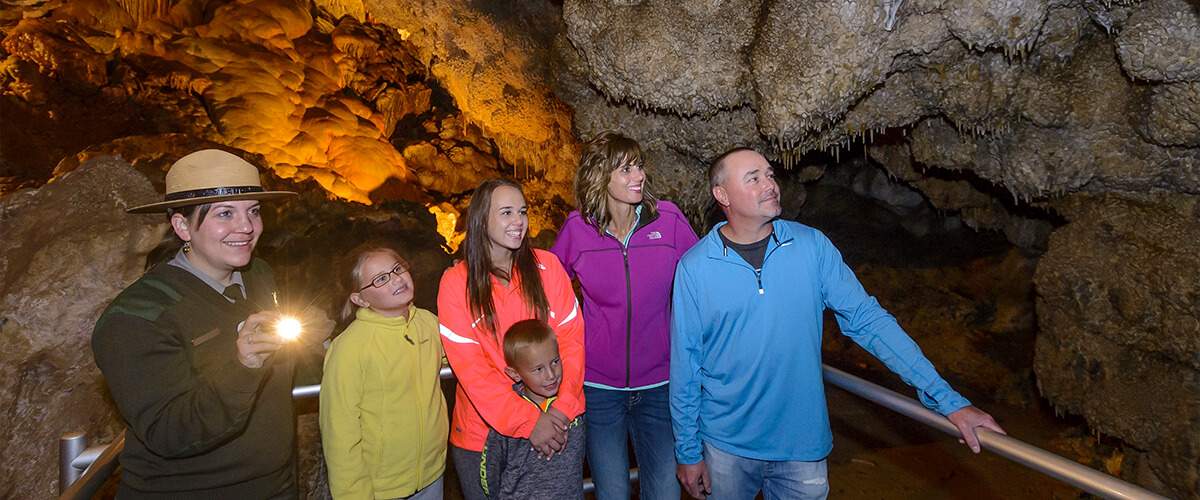 Photo of a family and guide deep inside of Jewel Cave.