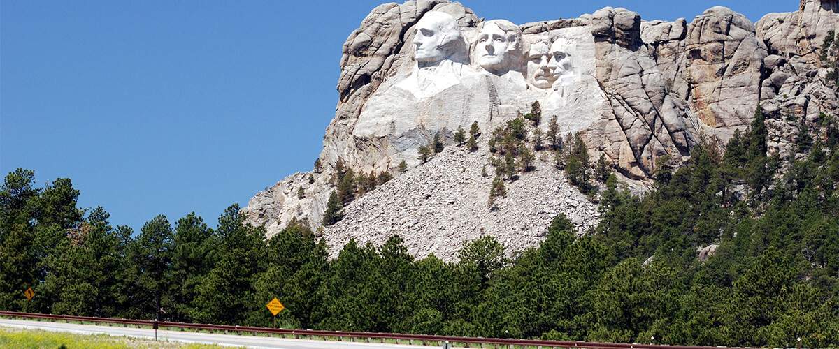 Photo of Mount Rushmore from Highway 16 near the monument's entrance.