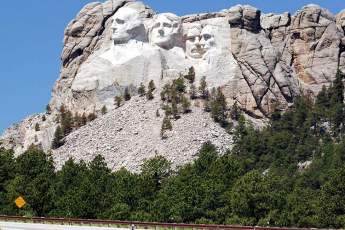 Photo of Mount Rushmore from Highway 16 near the monument's entrance.