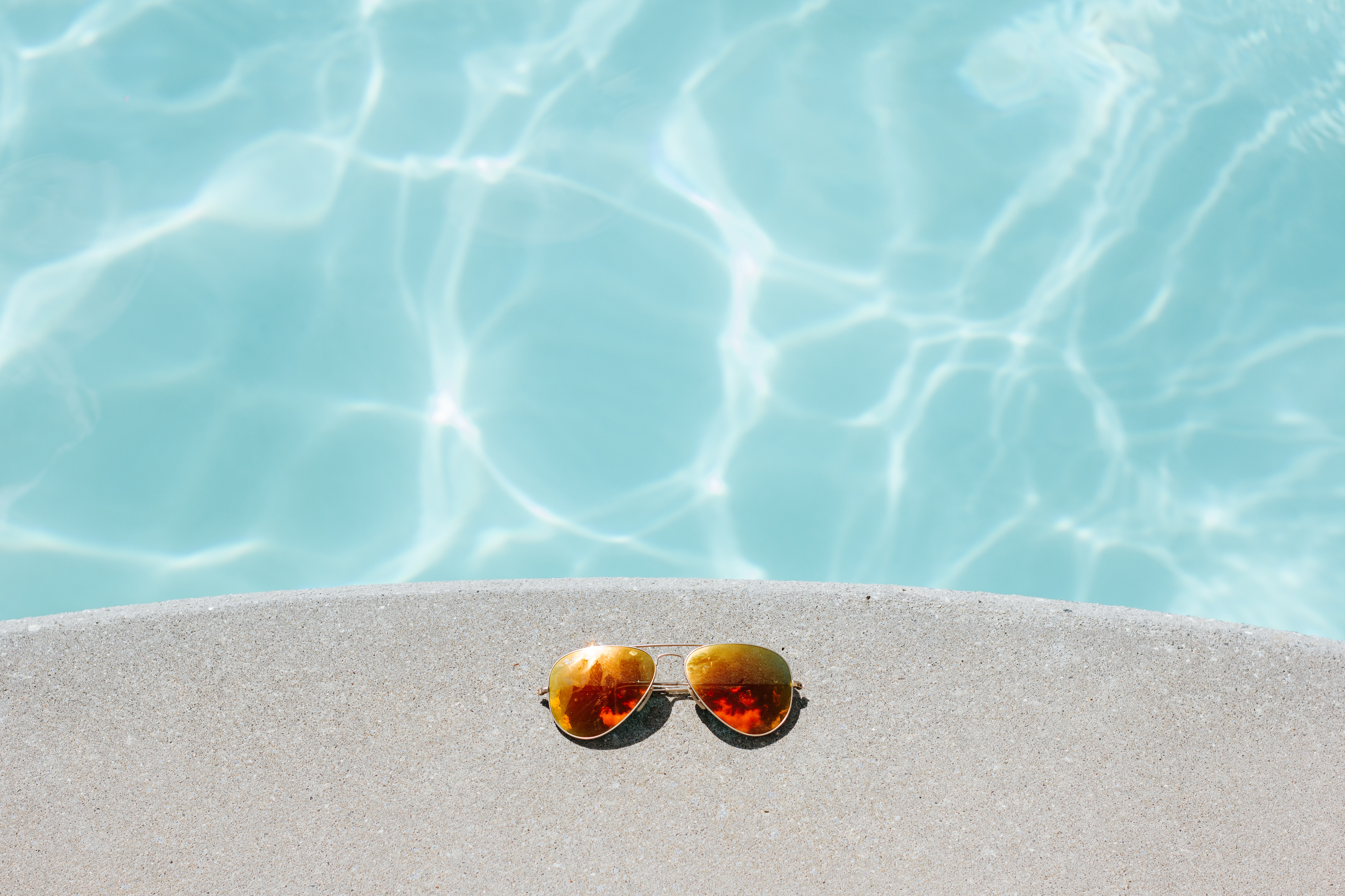 Sunglasses by pool